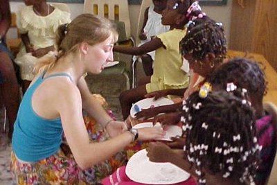 Abby helping a student in class.
