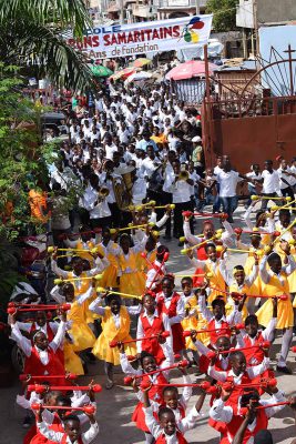 Colorful crowd of people marching.