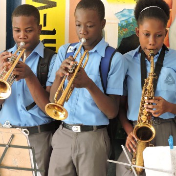 Three Secondary School Children Playing Music